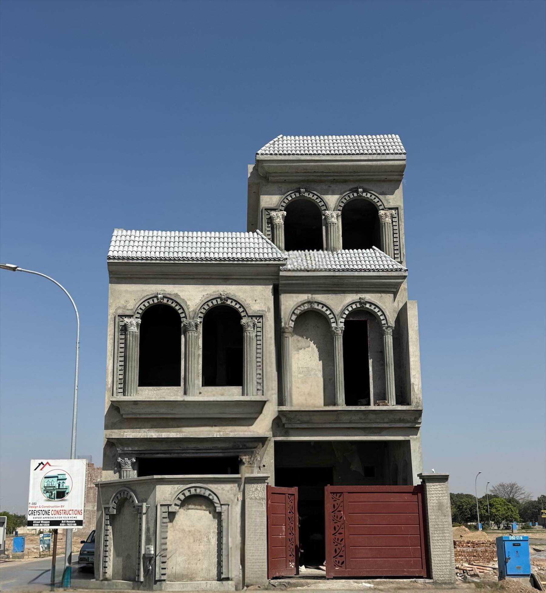 House under construction with front elevation work in Rahim Yar Khan by Greystone Constructions